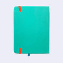 A turquoise notebook with a textured cover, featuring two bright orange elastic closure tabs and a small blue ribbon bookmark at the bottom, shown against a light gray background.