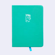 Turquoise pleather covered sketchbook with a small embossment of a robot carrying a flag that reads "Giant Robot" in the upper center.