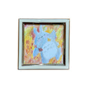 Framed artwork of a crayon Totoro, smiling and laying in fall leaves.