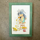Watercolor illustration of a girl sitting on a tall stool, curled up and peeling a mango with a gray cat sitting atop her head. Green frame.
