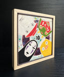 Ceramic tile of a light blue background with a dark purple circle. 4 characters surround each side: No Face, a large duck, a masked character and a radish spirit.