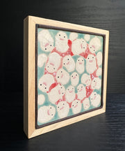 Ceramic tile, light blue with a light red circle. The foreground is full of white cloud like characters, Warawara from The Boy and the Heron.
