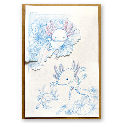 Blue and red pencil illustration of 2 axolotls swimming amongst coral and with an axolotl baby nearby.