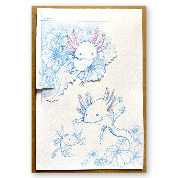 Blue and red pencil illustration of 2 axolotls swimming amongst coral and with an axolotl baby nearby.