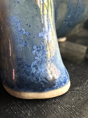 Close-up of a ceramic sculpture with blue glaze