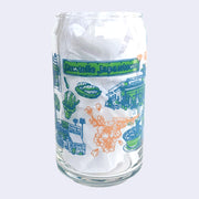 Glass cup with a flat base and slightly inward lip, it has printed design all over the cup. Various illustrations are within a color scheme of blue, green, orange. Illustrations include cherry blossoms, "Sawtelle Japantown" sign, a plant nursery and food.