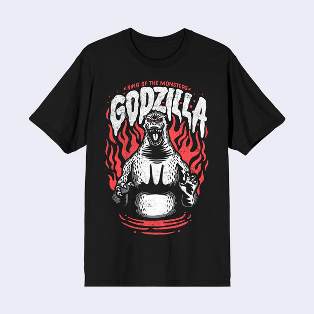Black t-shirt with a white ink graphic of Godzilla, standing and posing with its mouth open. Red flames rage around it and "Godzilla" is written in white stylized font overhead.