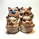 Group of 4 brown ceramic animals, rounded with cute front paws and a rounded bottom without legs.
