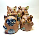 Group of 4 brown ceramic animals, rounded with cute front paws and a rounded bottom without legs.