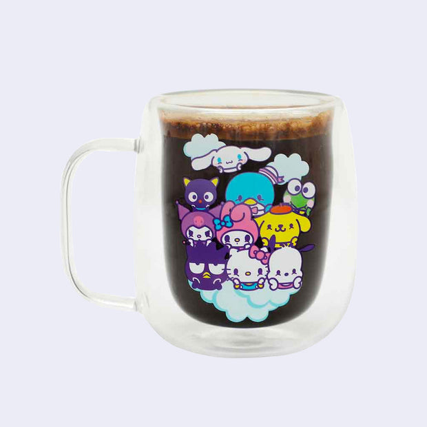 Double wall glass Hello Kitty and Friends mug holding a dark beverage with froth at the top.