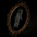 An ornate oval framed artwork featuring a white line drawing of a ghostly figure on a black background, set against a dark draped backdrop.