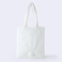 Back of white faux fur tote bag with a small, round 3D tail.