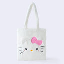 Fluffy white faux fur tote bag with Hello Kitty's face on the front, she has 3D fluffy ears, a pink box and kawaii eyes.