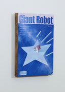 Painting of a mock Giant Robot Magazine cover, featuring a cover illustration of a house flying through the night sky atop of a very large light blue star. Fake text lines the sides.