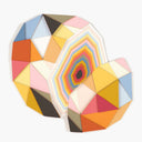Colorful geometric wall art pieces on a white background