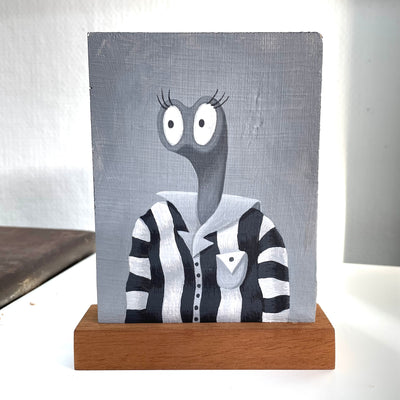 Greyscale painting of a creature with a long neck and pair of 2 eyelashed eyes, taking up their entire face. They wear a striped button up and pose as if getting their school picture taken.