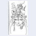 Spiral-bound notebook with a black and white illustration of a face with intricate headgear on a white background.