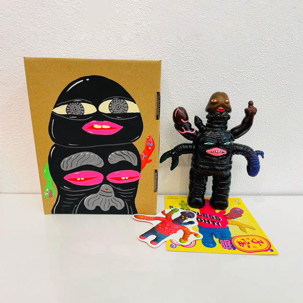 Black soft vinyl figure of a creature with many arms, mostly penis shaped along with a claw and a human hand, jutting out of its body. It stands next to a painted box.