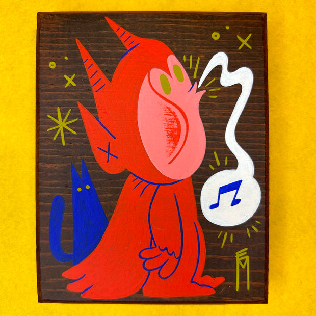 Painting on dark stained wooden panel of a pink character in a red devil costume complete with a cape. He whistles and a blue cat stands behind him.