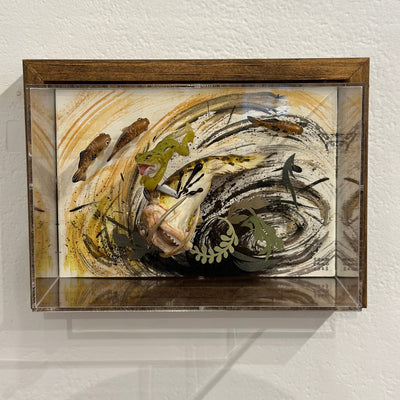 Mixed media diorama scene of a small green frog slaying a large monstrous fish with a knife, splaying the fish's guts over the scene.