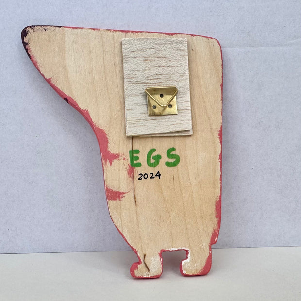 Backside of cut wooden sculpture, with the artist's signature.