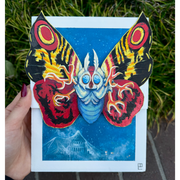 Painting of Mothra, with bright red, yellow and black wings and many clawed feet coming out of its body. It flies over a blue town, covered in a thin white web.