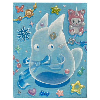 Painting on blue canvas of a see through small Totoro like spirit. On the surface behind it are many trinkets, stars and heart shaped items with a sheen to them.