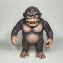 Vinyl figure of a brown gorilla.