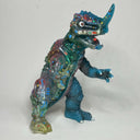 Toy dinosaur figure with a clear plastic body on a white background