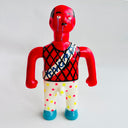 Red figurine with a colorful outfit on a white background