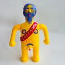 Colorful figurine with blue hair and a red sash on a white background