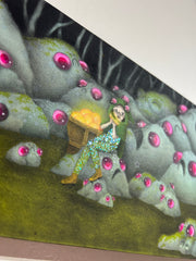 Illustration of a dark forest with many rocks, all with frowning faces and large pink shiny eyes. In the center sits a girl in a green hood and tights. Behind her is a crate holding glowing golden objects. Side view displays her pants are made out of sequins. 