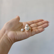 Set of 3 small ceramic sculptures of ducks, with cute sparkly eyes and pink cheeks.