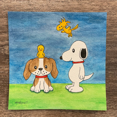 Watercolor painting of of a beagle sitting with a chick sitting atop its head. Standing next to them is Snoopy, who smiles and Woodstock flies behind him.