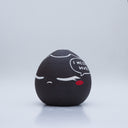 Small black vase with a drawing of a character with closed eyes and rosy cheeks. They have a speech bubble that reads "I Need a Hug!"