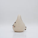 Ceramic sculpture made to look like a purse, with the face of a cute, closed eye cat with rosy cheeks and 3 stripes at the top of its head.