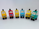 Group of clay sculptures of cartoon style taxis with cute simple smiley faces on the windshield.