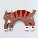 Flat clay artwork of a cat, mind jump, with a small cute cartoon smiling face. It is brown with reddish brown stripes.