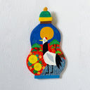 A hand-painted wooden wall hanging shaped like a gourd, featuring a stylized crane bird, yellow flowers, green leaves, and a yellow sun on a blue background, shown against a white textured wall.