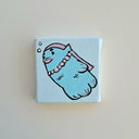 Very small canvas with a painting of a blue fish folklore woman, with pink pearl necklace and pink hair.