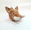 Ceramic sculpture of a boar head, with brown specked coloring and thick white tusks.