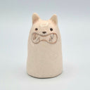 Ceramic sculpture of a ghost with an animal face and tiny animal ears.