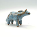 Blue and brown ceramic horse sculpture without any facial features.