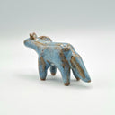 Blue and brown ceramic horse sculpture without any facial features.