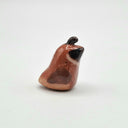 Very small ceramic sculpture of a quail.