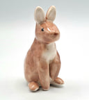 Brown ceramic bunny sculpture.