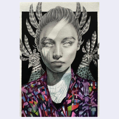 Artistic rendition of a portrait of a woman, done in graphite with stylized feathers and colorful clothing on a black background