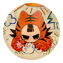Painting on rounded wooden panel of a stylized girl dressed in a tiger costume playing with a small mouse, surrounded by child-like doodles.