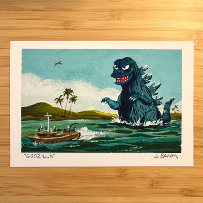 Illustration of Godzilla in the ocean with a boat and palm trees in the background, on a wooden surface.
