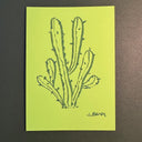 Marker illustration on bright green paper of a cactus.
